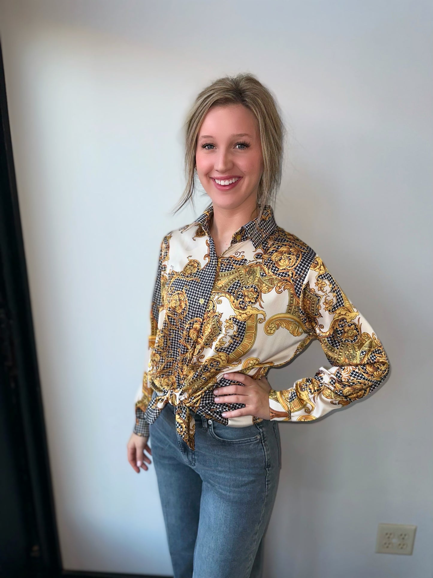 black and gold long sleeved button down collar shirt