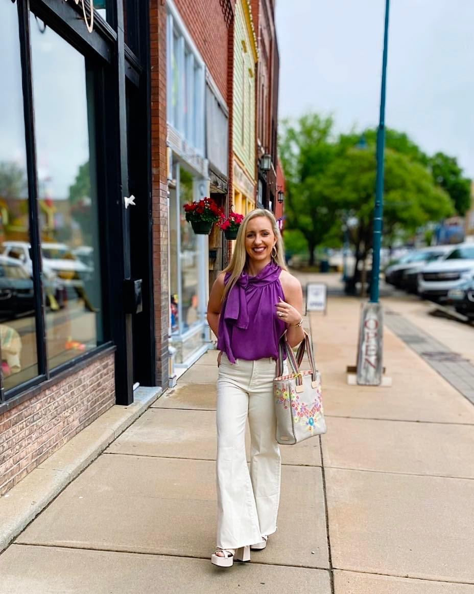 Purple sleeveless tie blouse